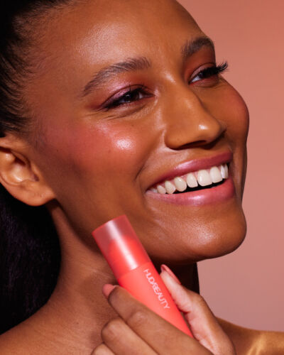 Huda Beauty Cheeky Tint Blush Stick Coral Cutie bright orange-pink