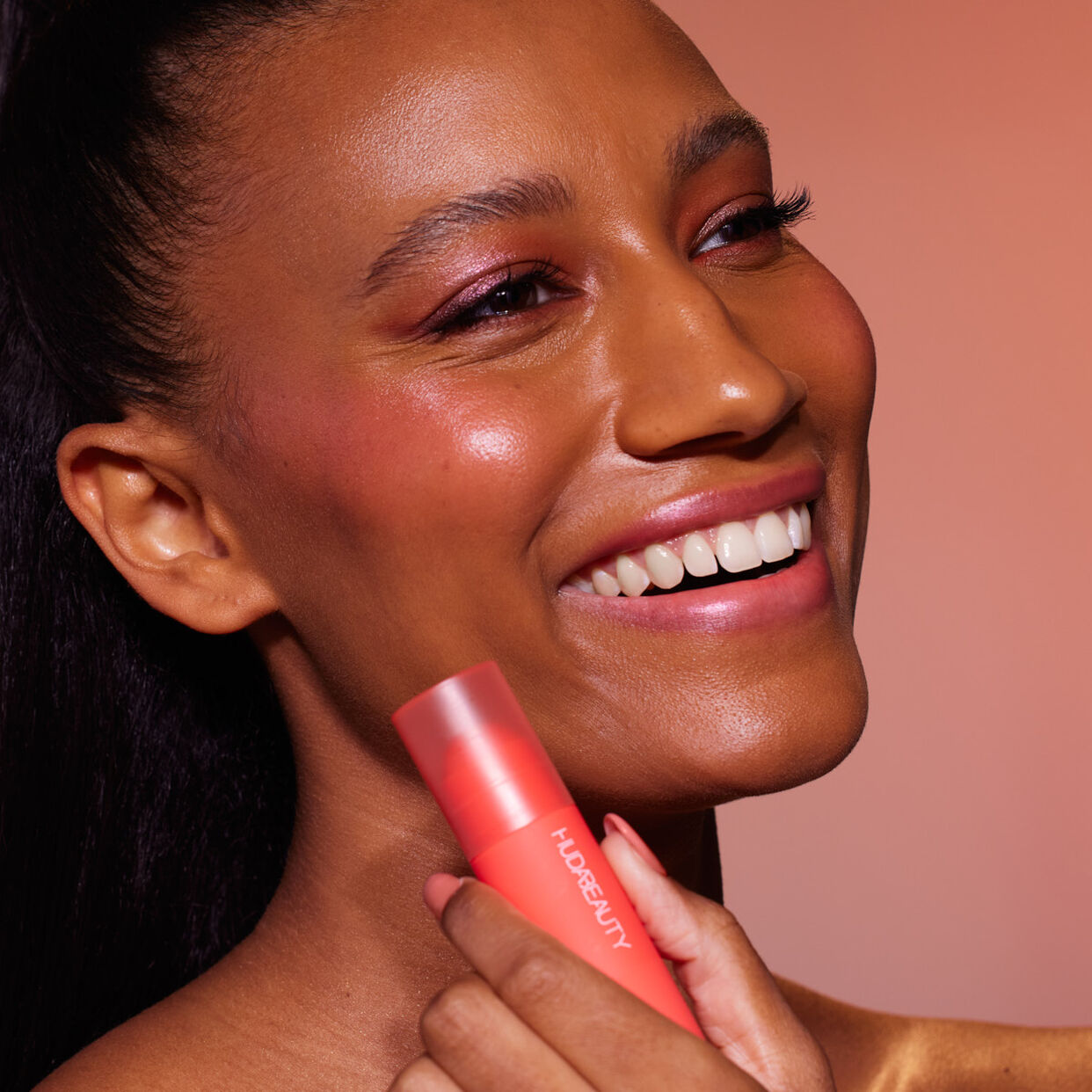 Huda Beauty Cheeky Tint Blush Stick Coral Cutie bright orange-pink